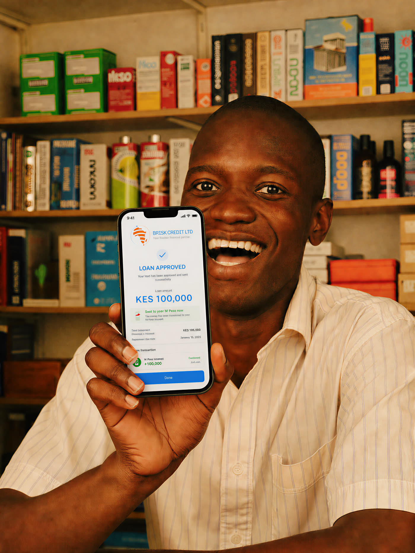 A delighted Kenyan shop owner showing his approved Brisk Credit loan